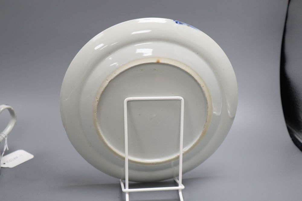 Five pieces of Chinese ceramics including two blue and white plates, a Canton plate, a blue and white mug and a prunus jar and cover,